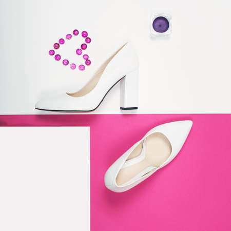 Shoes fashion. Stylish Trendy white heels on a pink background. Summer fashion Outfit, Luxury Party shoes. Minimal fashion concept.の写真素材
