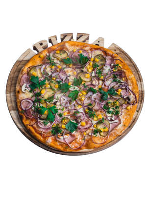 Italian pizza with ham corn cucumber and onion. A series of different types of pizza for menus from one angleの写真素材