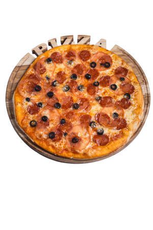 Italian pizza with salami olives and tomato. A series of different types of pizza for menus photographed from one angle.の写真素材
