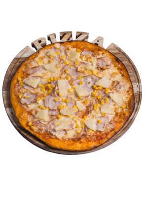 Italian pizza with ham pineapple and corn. A series of different types of pizza for menus photographed from one angle.の写真素材