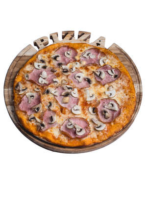 Italian pizza with ham and mushrooms. A series of different types of pizza for menus photographed from one angle.の写真素材