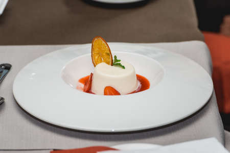 sweet mini dessert with strawberry on a plate in the expensive restaurant. close view. food and wine tastingの写真素材