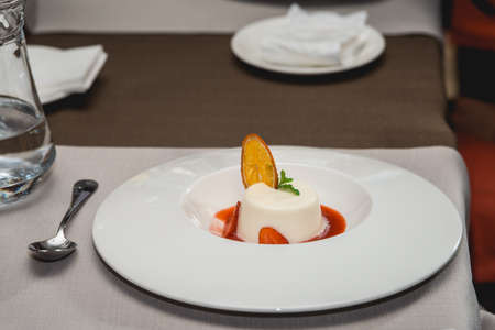 sweet mini dessert with strawberry on a plate in the expensive restaurant. close view. food and wine tastingの写真素材