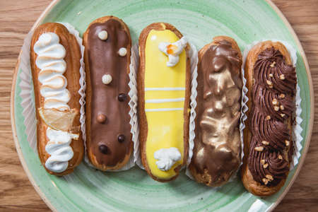 Eclairs with different ganache and icing with different toppings
