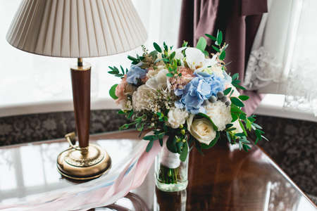 luxurious wedding bouquet made of roses, carnation and hydrangeaの写真素材