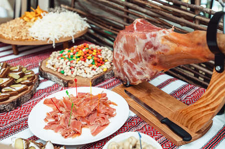 Prosciutto Ham served on a rustic wooden board with wine . Rustic Styleの写真素材