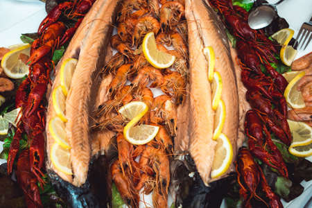 Baked salmon fillet with crayfish and shrimpの写真素材