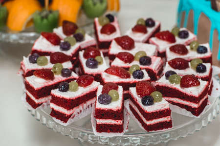 Strawberry cake with sour cream on a glass standの写真素材