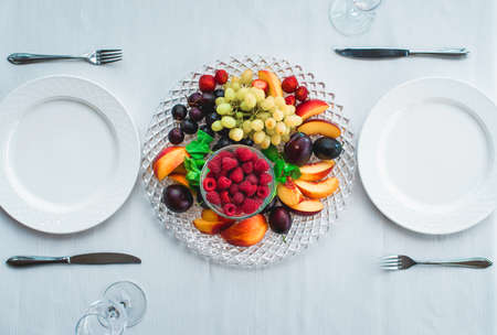 plums raspberry peach strawberry grapesの写真素材