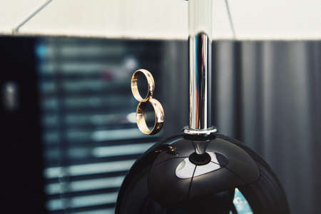 Pair of wedding golden rings levitating