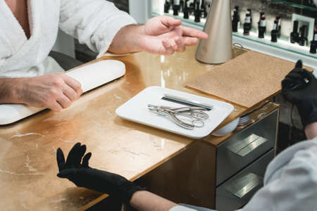 manicure instruments set on white plateの写真素材