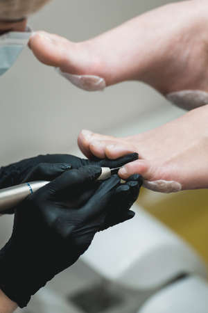 Professional hardware pedicure using electric machine.Patient on medical pedicure procedure,の写真素材