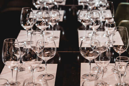 empty glasses of different shapes served for a wine tastingの写真素材