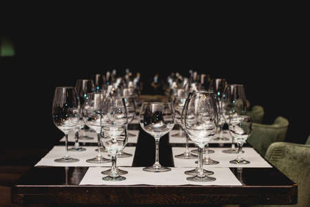empty glasses of different shapes served for a wine tastingの写真素材