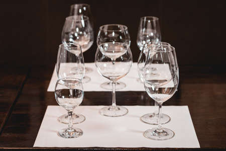 empty glasses of different shapes served for a wine tastingの写真素材