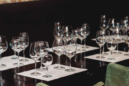 empty glasses of different shapes served for a wine tastingの写真素材