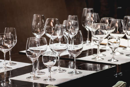 empty glasses of different shapes served for a wine tastingの写真素材