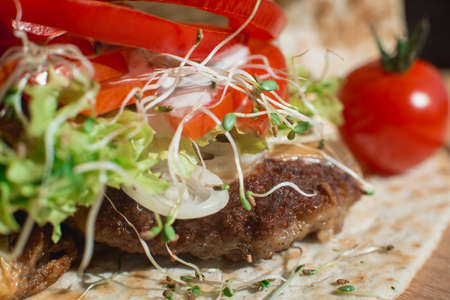 great mexican taco with meat schnitzel with cheese and vegetablesの写真素材