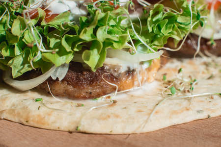 great mexican taco with meat schnitzel with cheese and vegetablesの写真素材