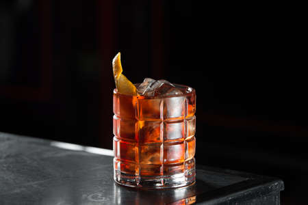 Boulevardie cocktail on a bar desk. black backgroundの写真素材