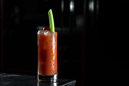 Bloody Mary on a bar desk. black background.の写真素材