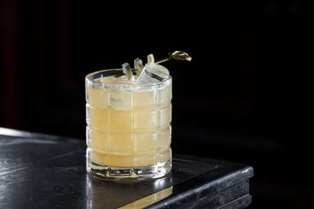 Penicillin cocktail on a bar desk. black background.の写真素材