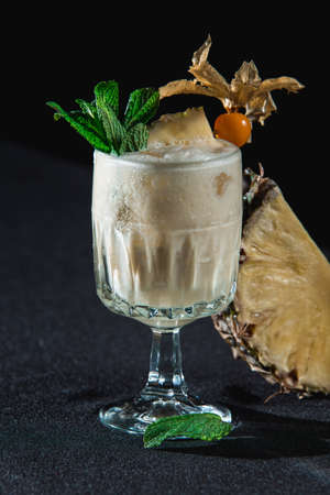 Pina Colada cocktail. exemplary tropical mixed drink with rum, pineapple and coconut drainの写真素材