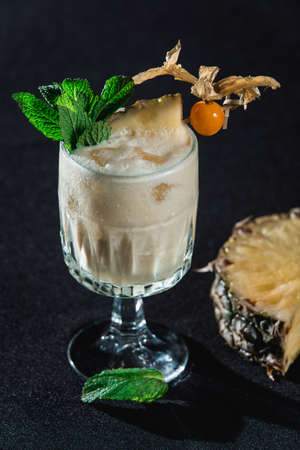 Pina Colada cocktail. exemplary tropical mixed drink with rum, pineapple and coconut drainの写真素材