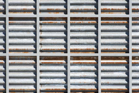 Rusty grunge metal texture. Iron grid background.の写真素材