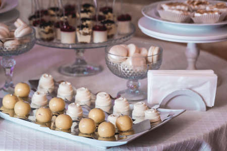 white Cakes and cupcakes on vintage white dishの写真素材