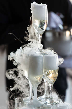 Wedding slide champagne for bride and groom indoors.の写真素材
