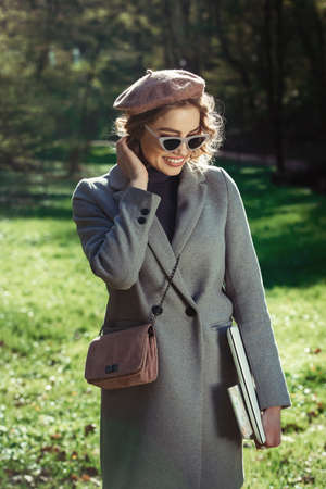 Work outdoors benefits. Education technology and internet concept. Girl in a stylish sunglasses with...