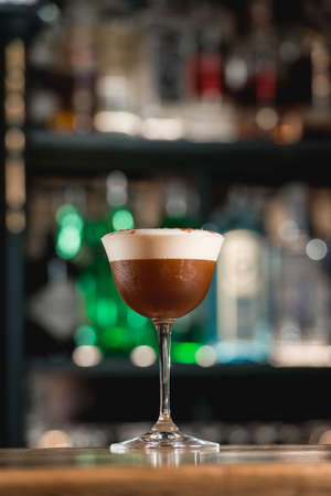 Espresso vodka cocktail on a bar desk. Bright backgroundの写真素材