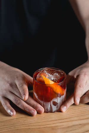 Boulevardie cocktail on a bar desk. Black background.の写真素材
