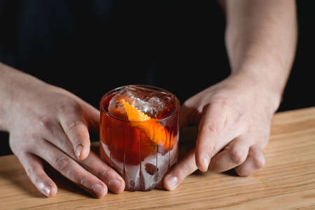 Boulevardie cocktail on a bar desk. Black background.の写真素材