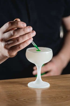 Homemade Pisco Sour Cocktail with Lime and Bittersの写真素材