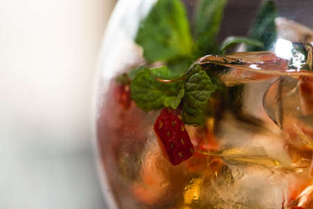refreshing coctail with strawberries isolated on a bar backgroundの写真素材