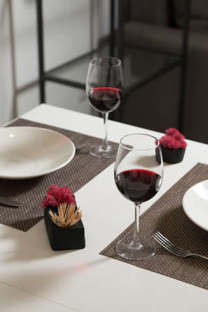 Glassware and cutlery for catered event dinner. Glasses of wineの写真素材