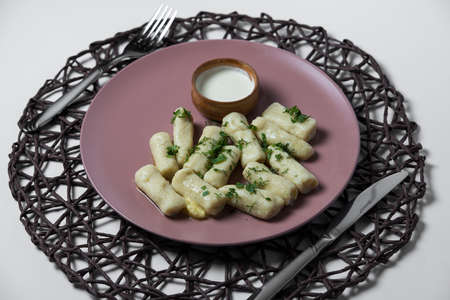 potatoe sticks, homemade traditional Ukrainian dish palyushky with sour creamの写真素材