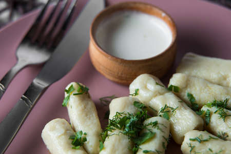 potatoe sticks, homemade traditional Ukrainian dish palyushky with sour creamの写真素材