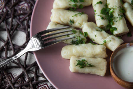 potatoe sticks, homemade traditional Ukrainian dish palyushky with sour creamの写真素材