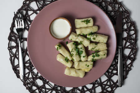 potatoe sticks, homemade traditional Ukrainian dish palyushky with sour creamの写真素材