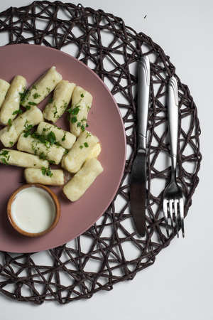 potatoe sticks, homemade traditional Ukrainian dish palyushky with sour creamの写真素材