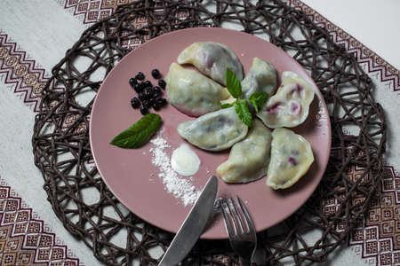 dumplings with bilberry, homemade traditional Ukrainian dish varenyky.の写真素材