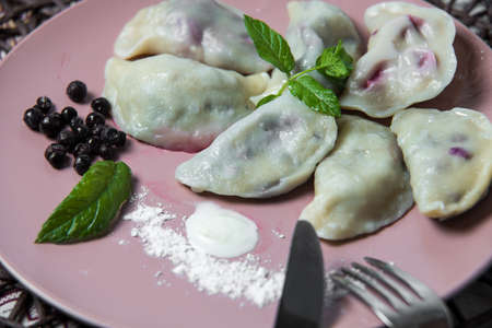 dumplings with bilberry, homemade traditional Ukrainian dish varenyky.の写真素材