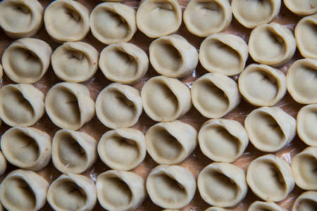 Russian raw meat dumplings. manual production.の写真素材