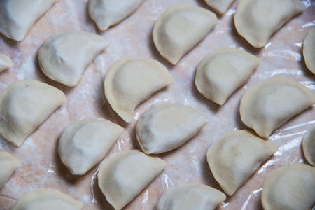 The texture is a large number of vareniks of wheat flourの写真素材