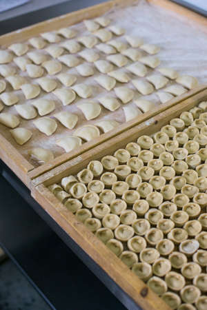 Russian raw meat dumplings. manual productionの写真素材