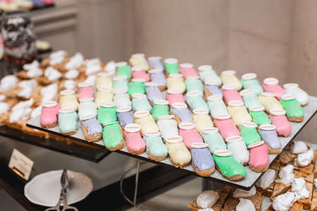 sweet and colorful eclair on glass. french eclair with word winner on top. hight angle view.の写真素材