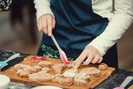 Close up of cookies baking. Little kids hands.の写真素材